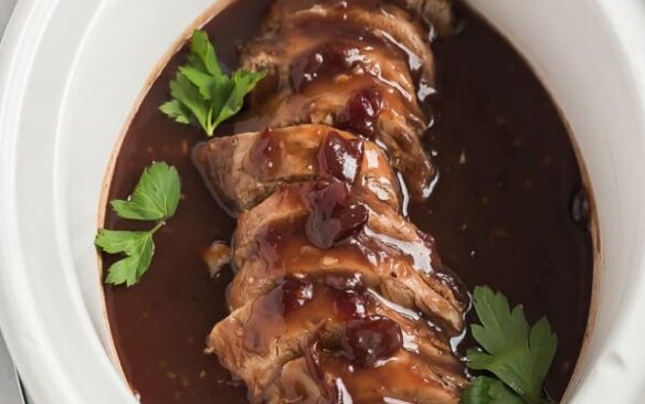 crock pot pork tenderloin with cranberry sauce in slow cooker