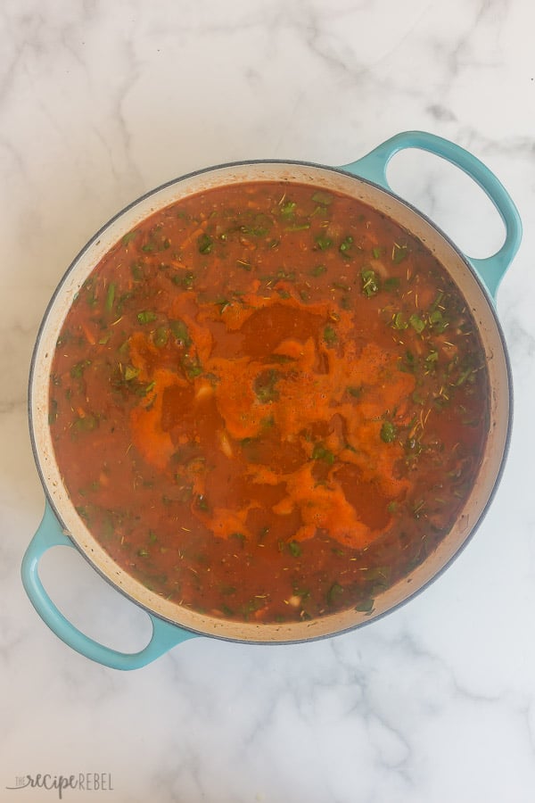 liquid ingredients added to ground beef and vegetables for spaghetti