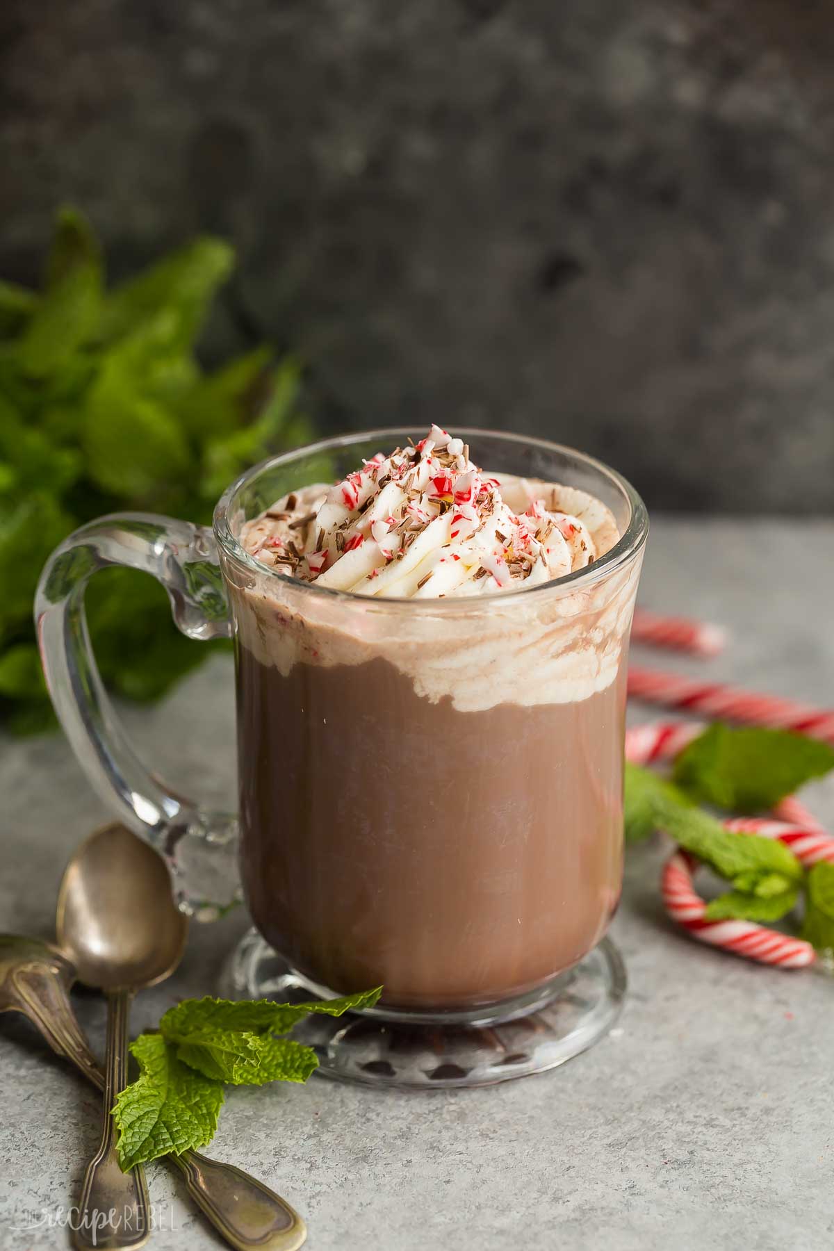 peppermint mocha in a clear mug against a black background.