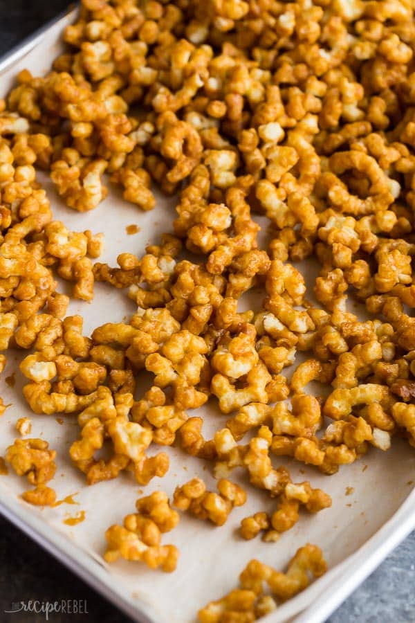 caramel puff corn on sheet pan lined with parchment paper 