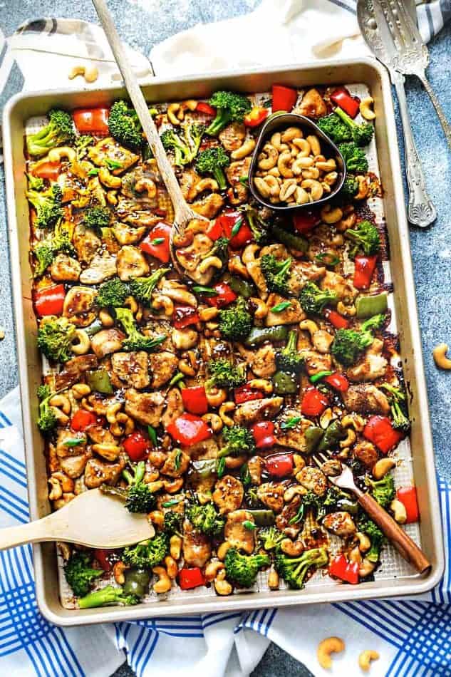 sheet pan cashew chicken dinner with red peppers and broccoli