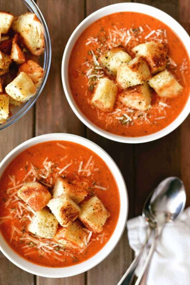 pizza soup overhead in two white bowls with croutons on top