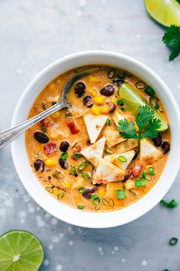 slow cooker spicy chicken quesadilla soup in white bowl overhead on grey background