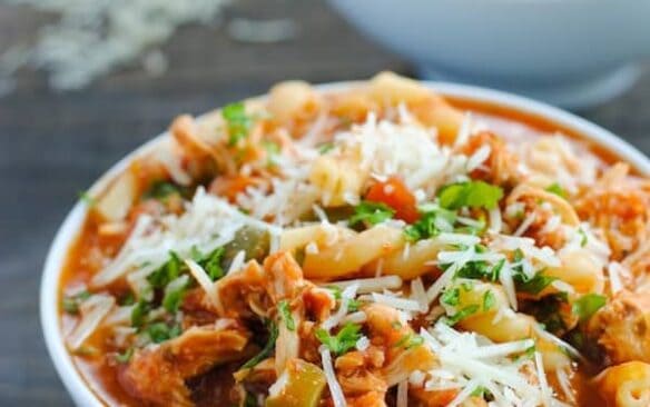 close up image of chicken parmesan soup in bowl