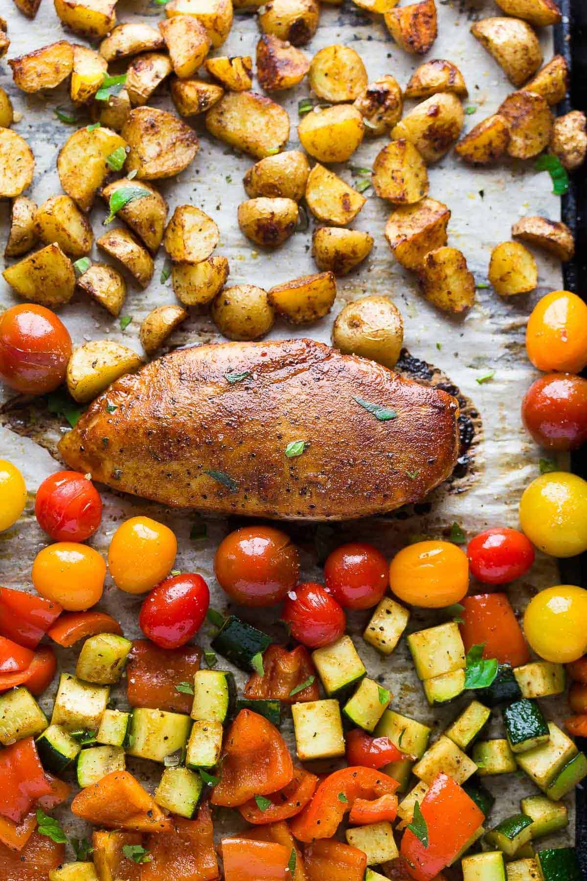 paprika chicken sheet pan dinner with little potatoes and fresh tomatoes and zucchini
