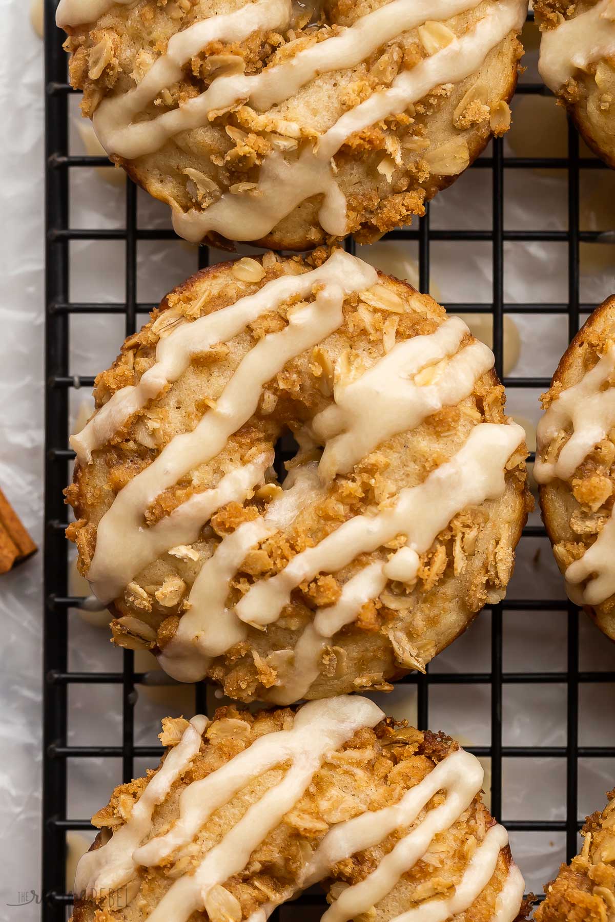 close up overhead image of apple baked donut with glaze.