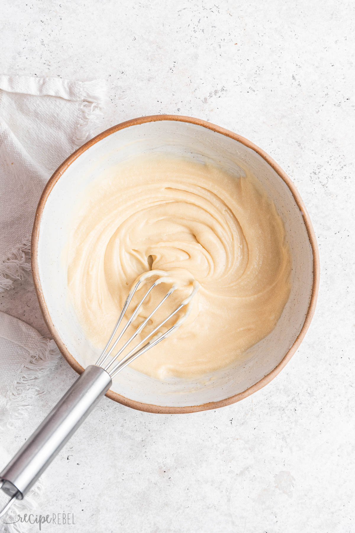 glaze whisked together in bowl ready for donuts.