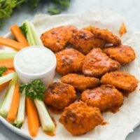boneless chicken wings with buffalo sauce on white plate