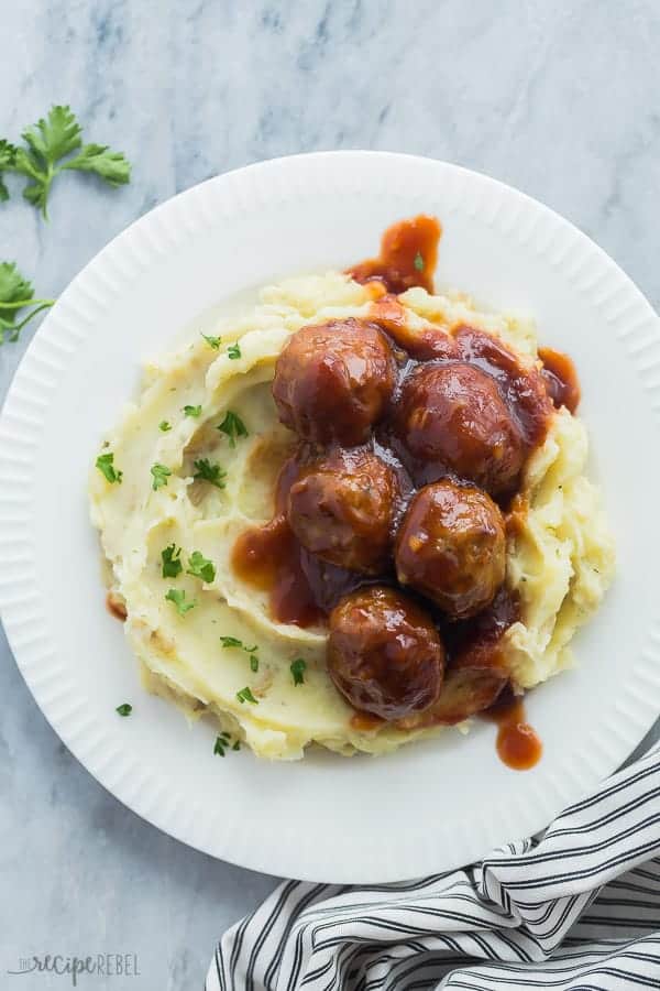 instant pot meatballs and mashed potatoes overhead on a white plate on marble background