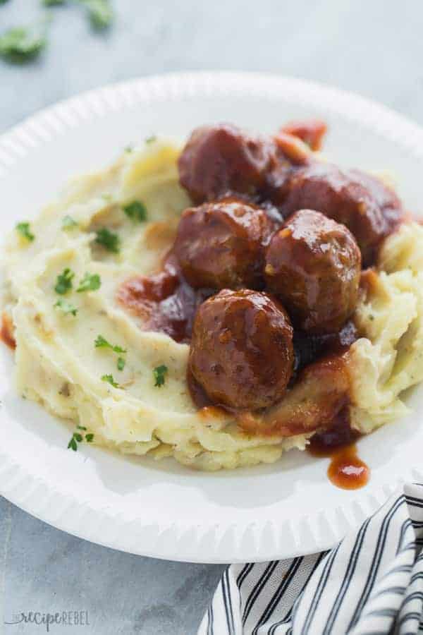 instant pot meatballs close up on mashed potatoes on a white plate