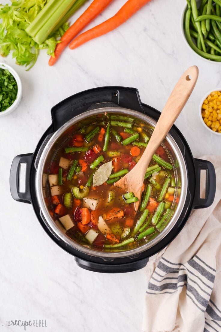 uncooked vegetable soup in instant pot ready to pressure cook