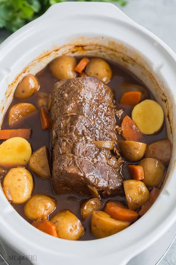 These EASY Crockpot Meals are perfect for those busy weekdays when it's a struggle to get dinner on the table, cozy and comforting for cooler days, or light and fresh for summer days. There's something for everyone! Crockpot pasta, soups, tacos, slow cooker ribs, pork, chicken or beef. TONS of easy crockpot dinners. #crockpot #slowcooker #easyrecipe #recipe #recipes #dinner #cooking slow cooker pot roast after cooking in crockpot with potatoes and carrots