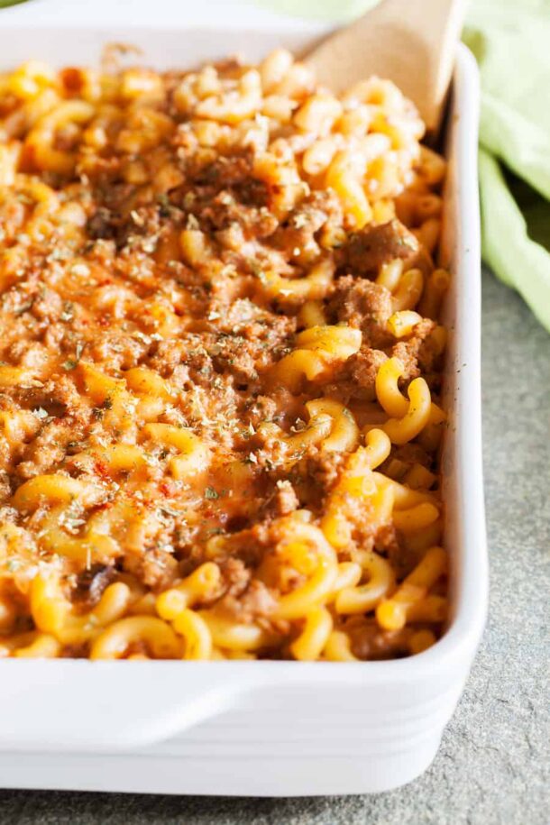 hamburger casserole with macaroni on white baking dish