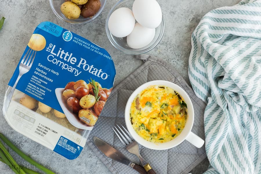 breakfast in a mug with eggs overhead and package of little potatoes