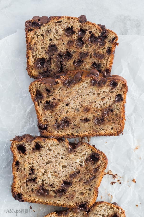 slices of chocolate chip banana bread on parchment paper overhead