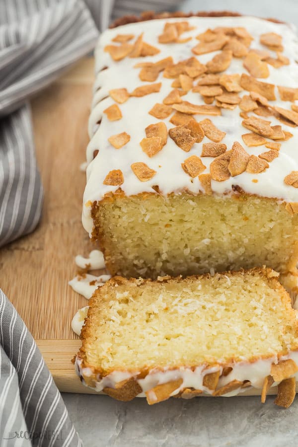 coconut bread with glaze sliced with cream cheese glaze and toasted coconut on top