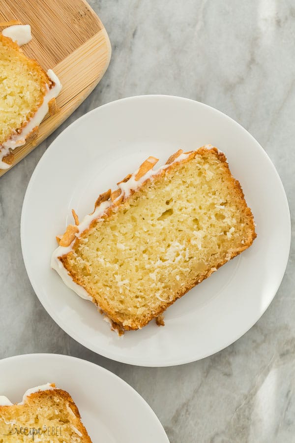 slice of coconut bread on white plate on marble background