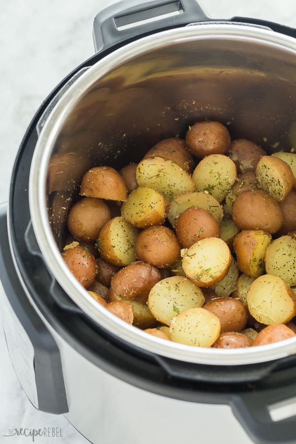 garlic herb instant pot potatoes in pressure cooker on marble background