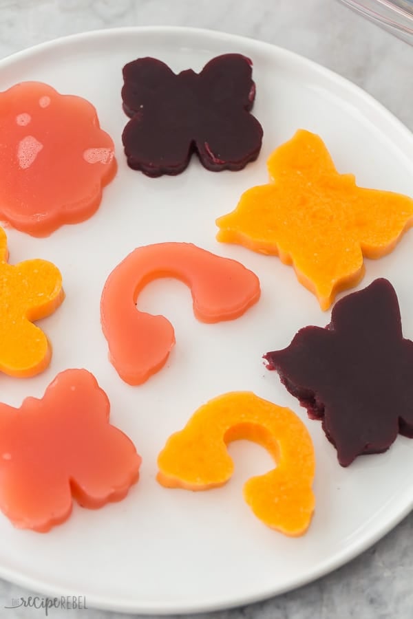 jello jigglers on white plate close up pink orange and purple