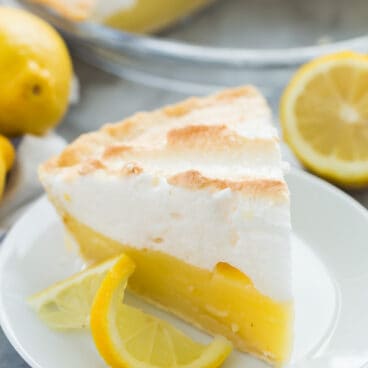 lemon meringue pie slice on white plate