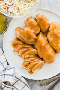 slow cooker bbq chicken on white plate overhead