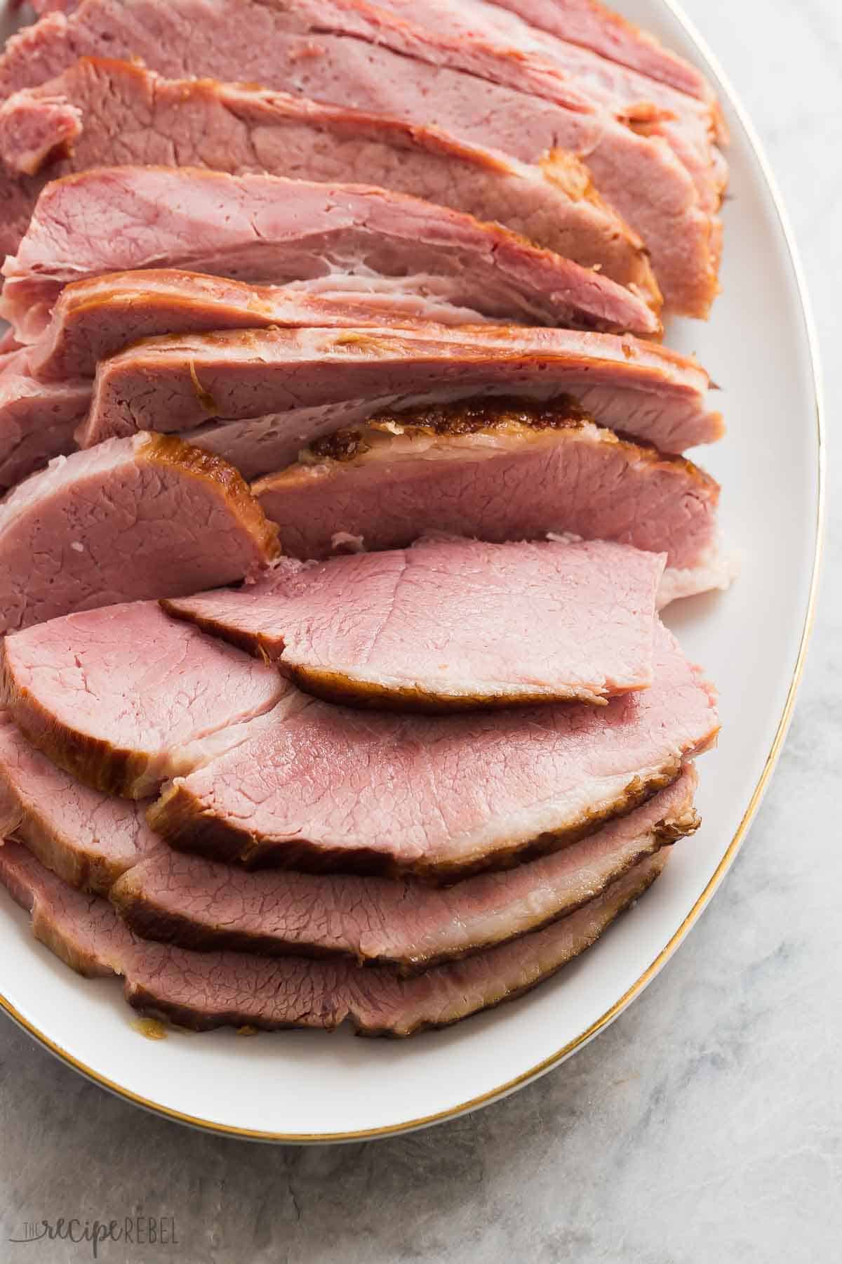 instant pot ham sliced close up on white platter