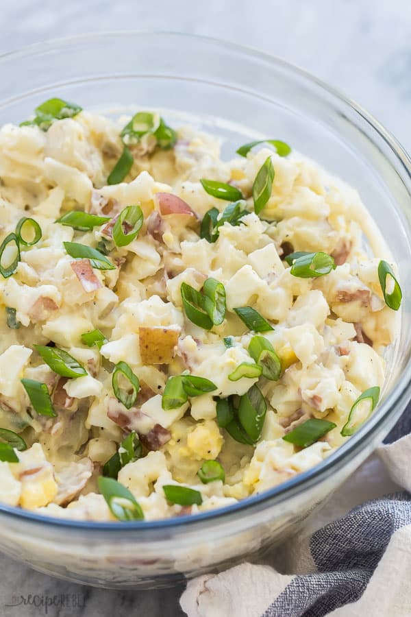instant pot potato salad close up glass bowl with sliced green onions