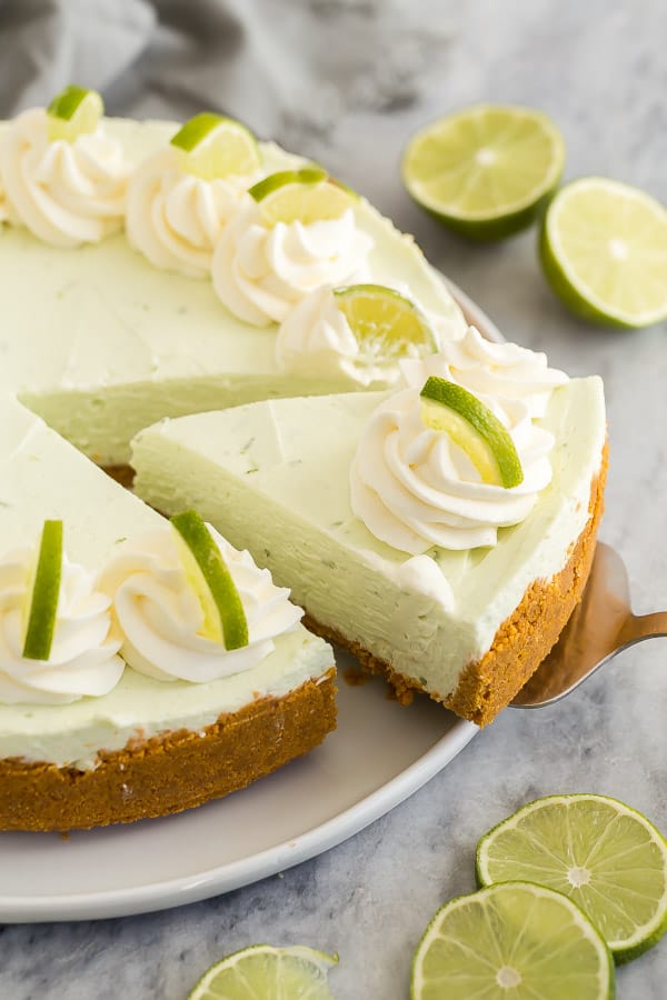 slice being pulled out of no bake lime cheesecake