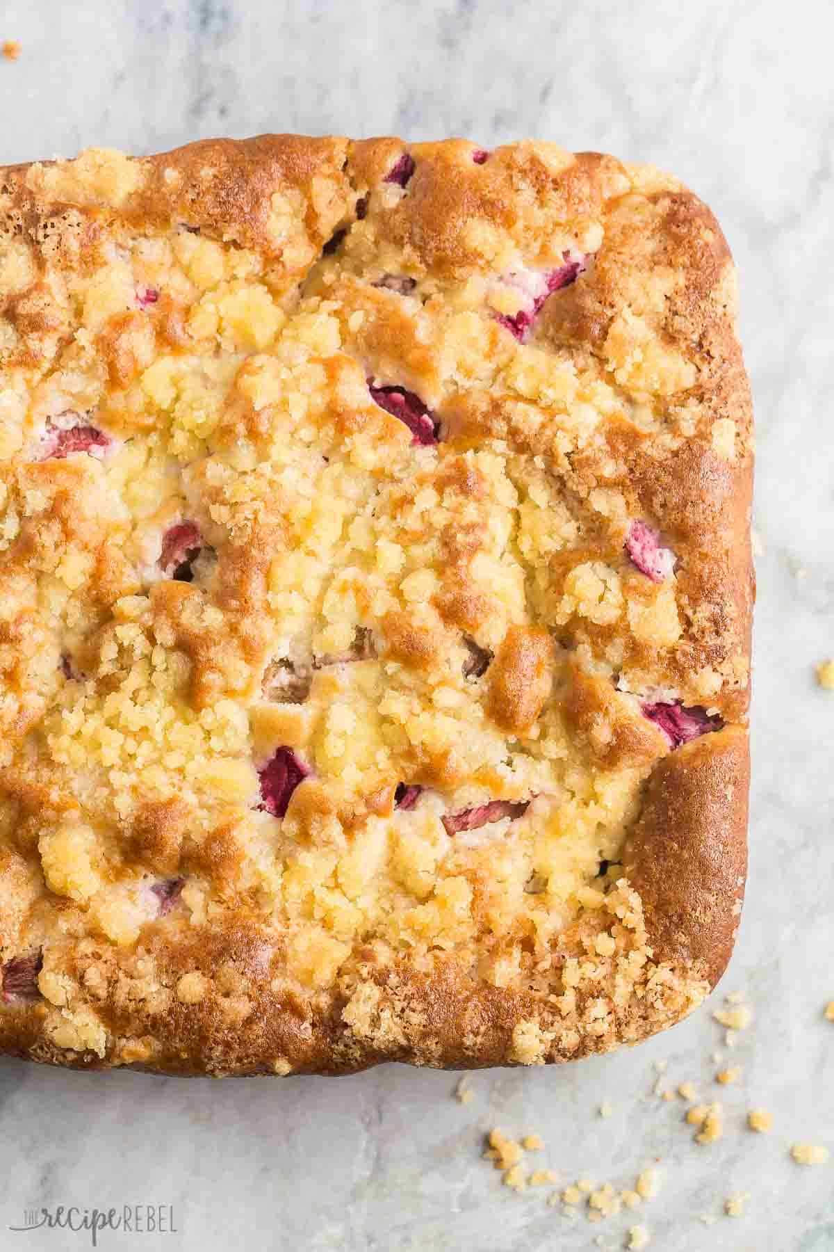 rhubarb cake whole overhead on grey marble background