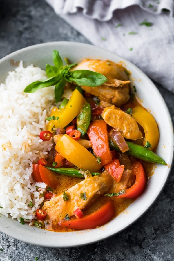 instant pot thai chicken curry on white plate on grey background