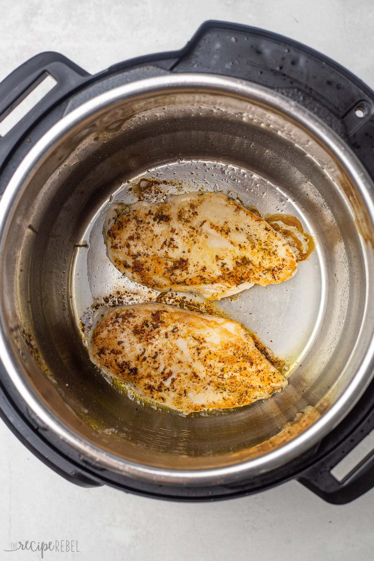 searing chicken breasts in the instant pot before pressure cooking.