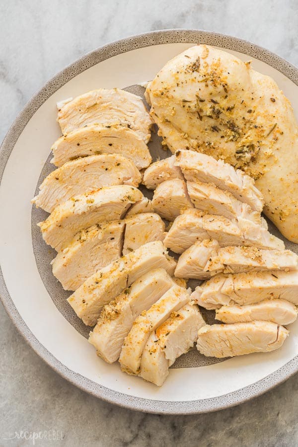 instant pot chicken breast sliced on grey plate on marble background