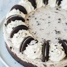 no bake oreo cheesecake whole on white plate