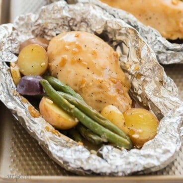 square image of honey garlic chicken foil packs.