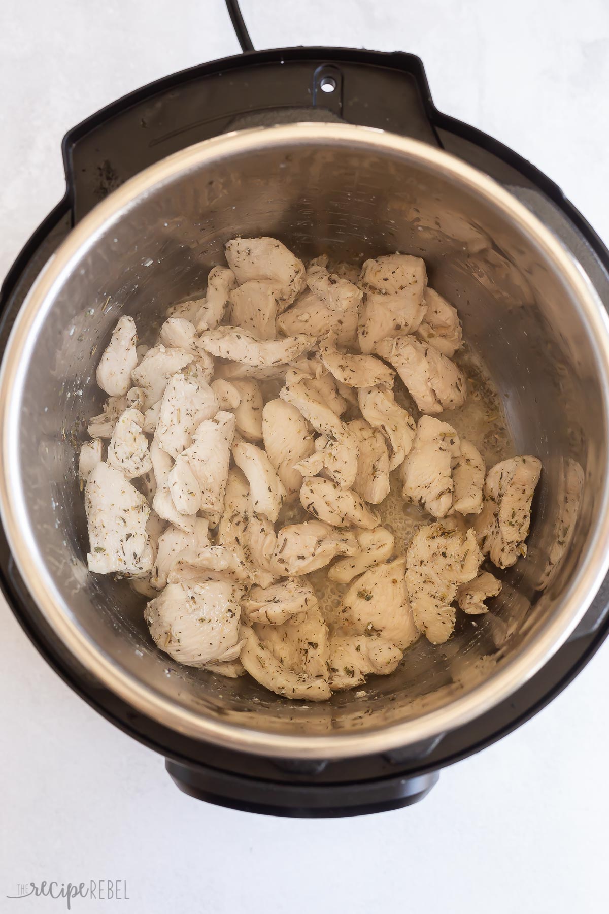 chicken breast pieces cooking in instant pot.