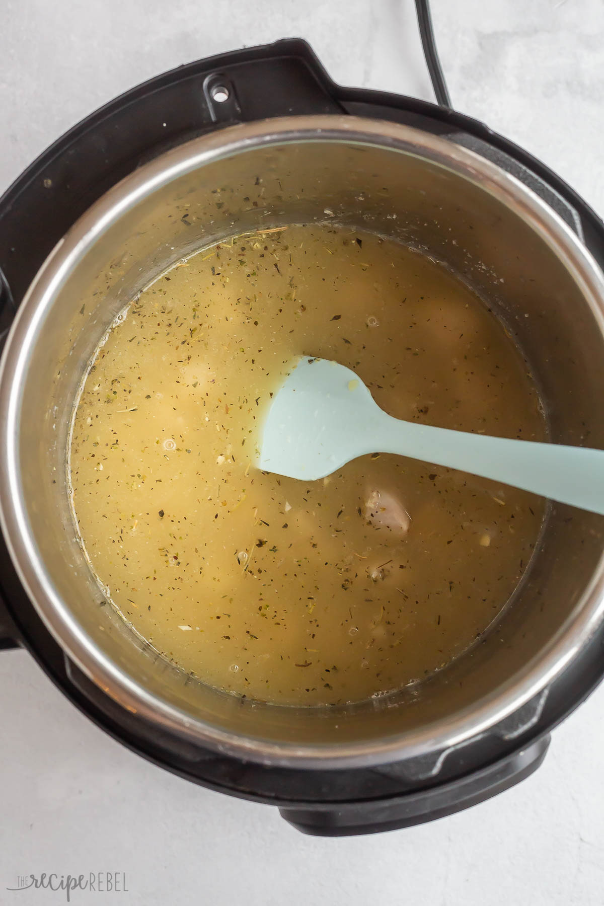 broth added to chicken in instant pot.