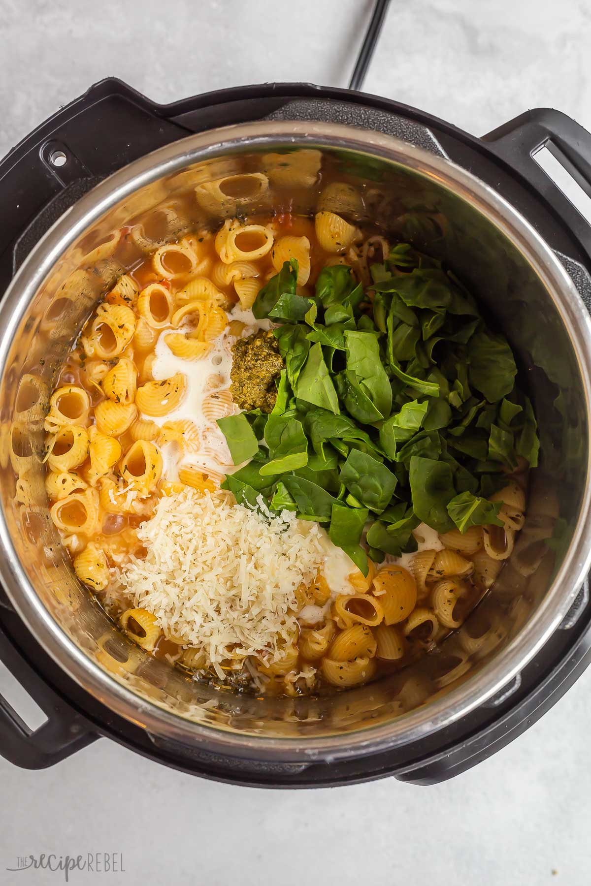 parmesan cream and spinach added to pasta in pressure cooker.
