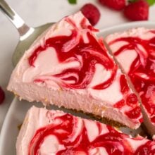 slice of cheesecake being lifted out of whole.