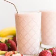 healthy strawberry smoothie with steel straw