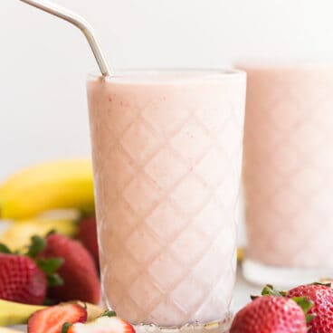 healthy strawberry smoothie with steel straw
