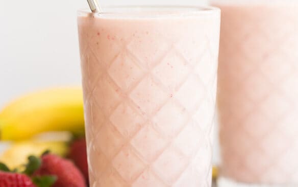 healthy strawberry smoothie with steel straw