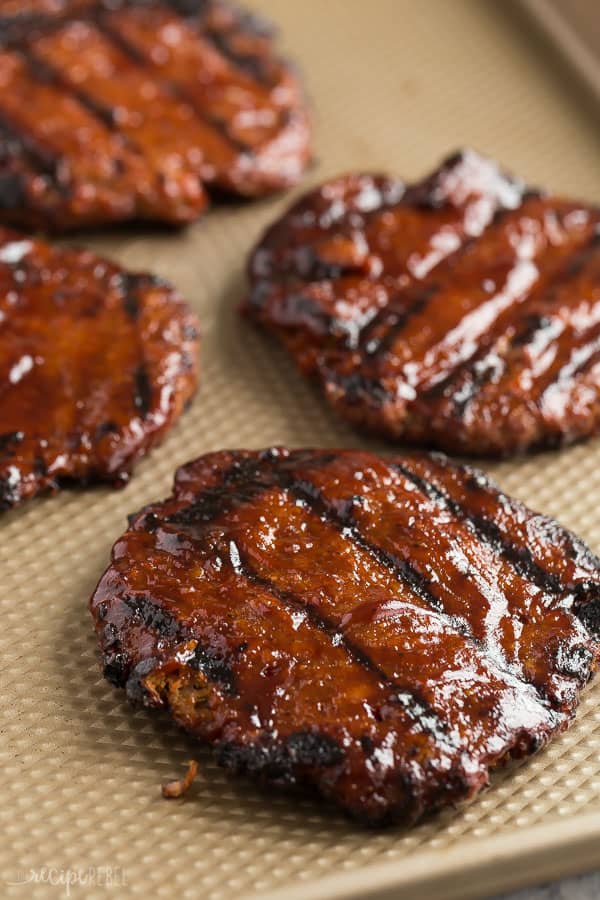 These Grilled Turkey Burgers are an easy summer meal that is make ahead and freezer friendly! The perfect healthy meal prep dinner for summer, and loaded with flavor! #turkey #burger #grilled #grilling #dinner #recipes turkey burgers with bbq sauce grilled on sheet pan