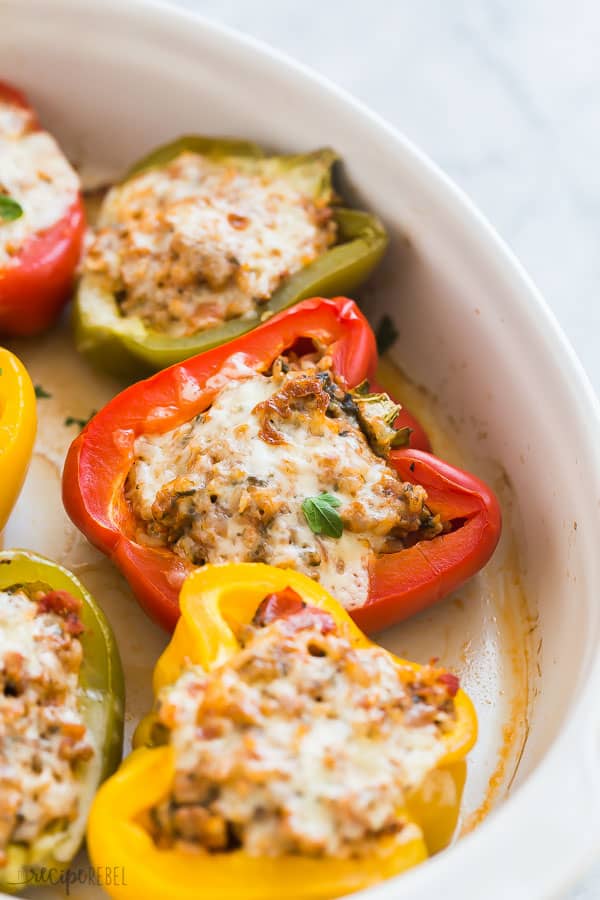 turkey stuffed peppers close up in white baking dish with white background