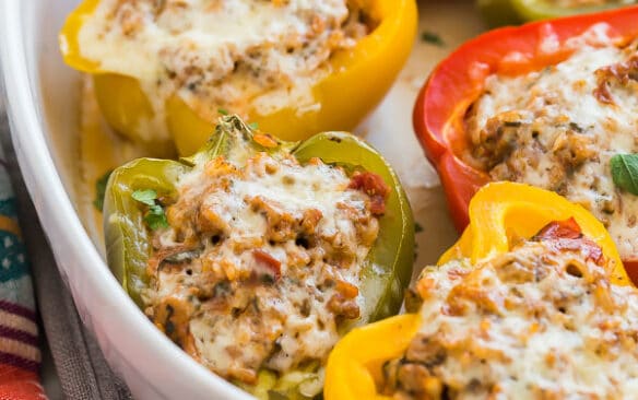 turkey stuffed peppers in white baking dish