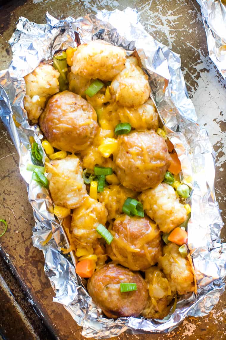 tater tot meatball foil packet overhead with fresh green onions