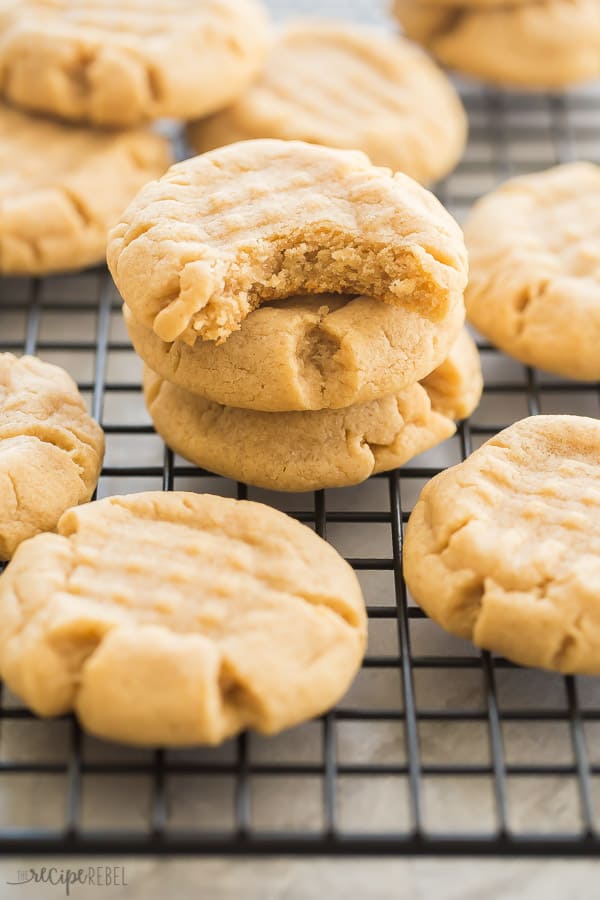 peanut butter cookies stack of three with one bite taken out of top cookie