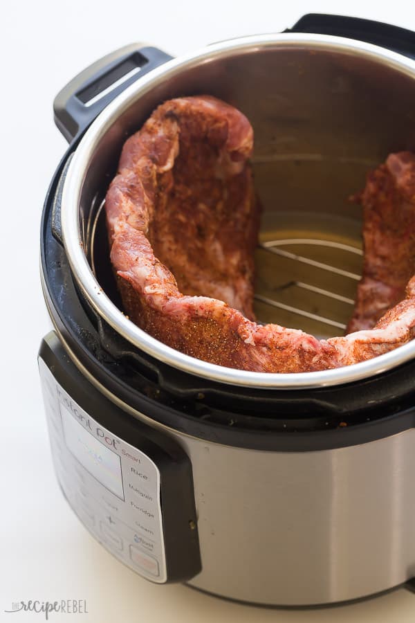 instant pot ribs in pressure cooker on white background
