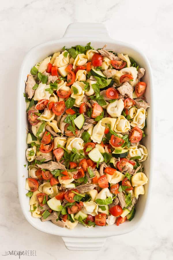 baked tortellini in baking dish with vegetables before baking