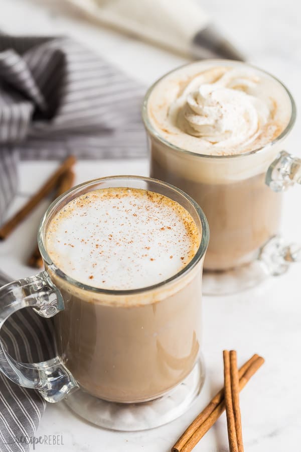 pumpkin spice latte with whipped cream or foam with grey towel in background