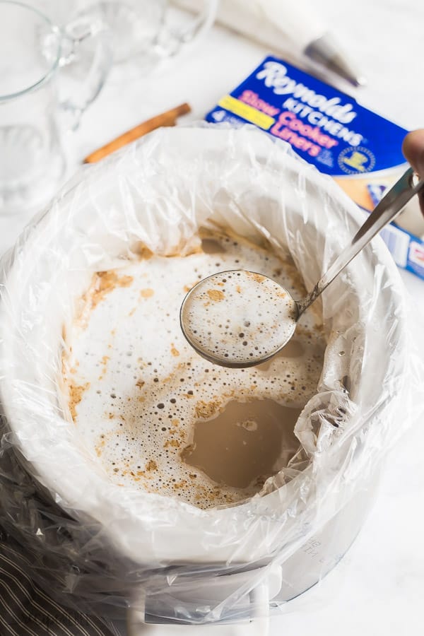 slow cooker pumpkin spice latte in crockpot with slow cooker liner